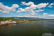 Travel photography:Houses along a river between Sihanoukville and Kampott , Cambodia