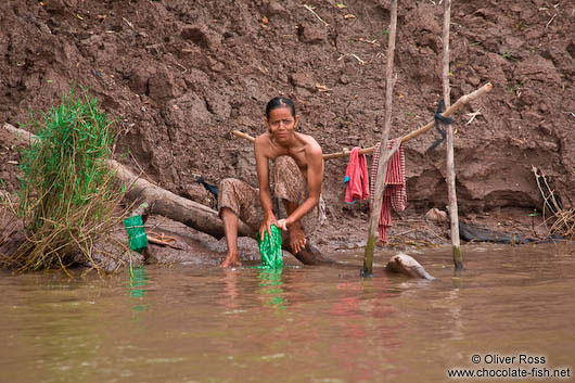 Washing clothes in the Mekong river 