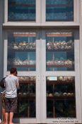 Travel photography:Collection of skulls indise the memorial stupa at the Killing Fields in Choeung Ek, Cambodia