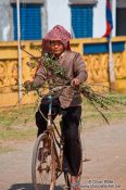 Travel photography:Man on bike near Odonk (Udong) , Cambodia