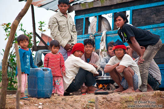 People cooking along the Stung Sangker river near Battambang