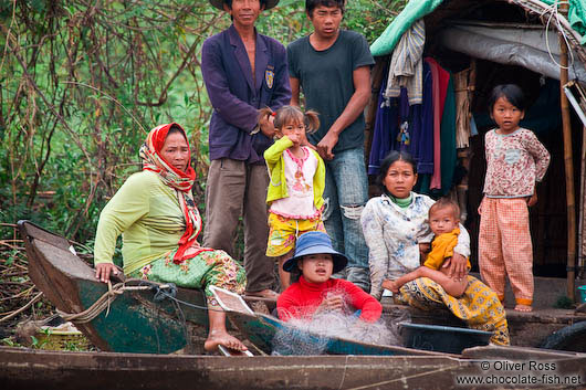 Family on their boat on the Stung Sangker river near Battambang