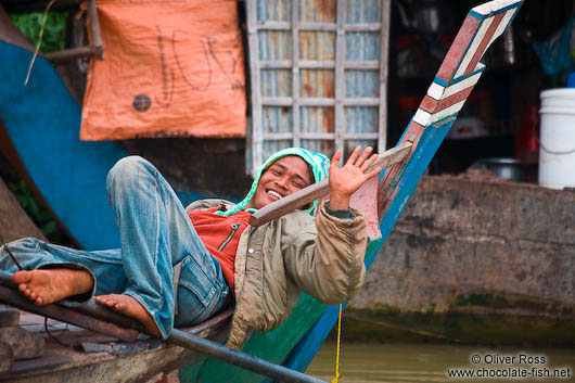 Man having a rest on his boat near Battambang