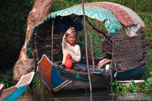 Boy on a boat near the Tonle Sap lake