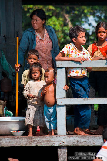 Family on their floating house near Tonle Sap lake