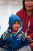 Travel photography:Small boy on a river near Battambang, Cambodia