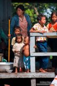 Travel photography:Family on their floating house near Tonle Sap lake, Cambodia