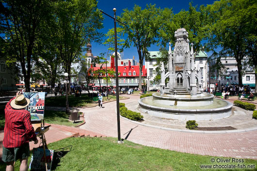 A painter at the place d´ armes square in Quebec