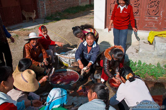 Women gutting some fish from Erhai lake near Dali