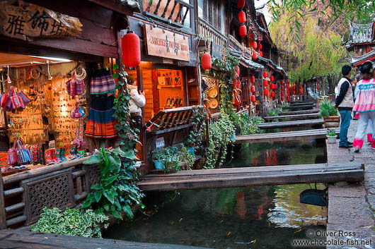 Channel with wooden bridges in Lijiang´s old town 