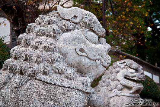 Stone lions at Wenchang palace in Lijiang