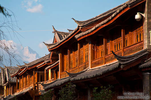 Lijiang traditional wooden houses with Jade Dragon Snow Mountain in the background