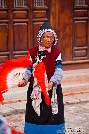 Naxi woman performing a traditional dance in Lijiang