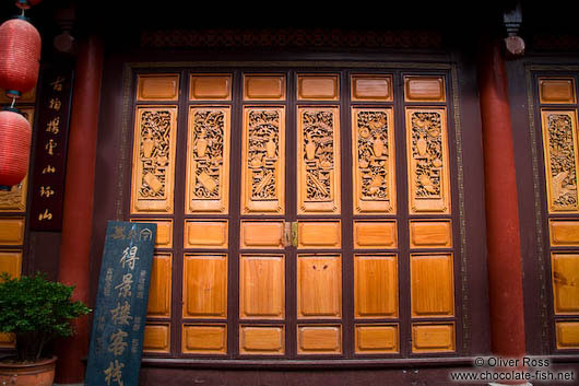 Ornately carved wooden door in Lijiang´s old town
