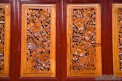 Travel photography:Ornate carvings on a wooden door in Dali, China