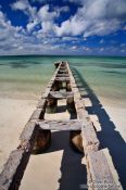 Travel photography:Derelict pier at Cayo-las-Bruchas beach, Cuba