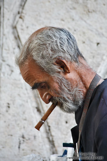 Man having a smoke in a public park in Havana