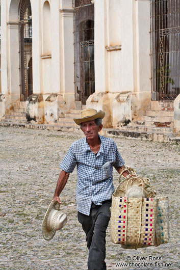 Man selling hats and baskets in Trinidad