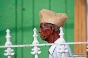 Travel photography:Man with paper hat in Trinidad, Cuba