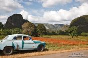 Travel photography:Car parked in the Viñales landscape, Cuba