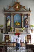 Travel photography:Man praying inside the Viñales church, Cuba