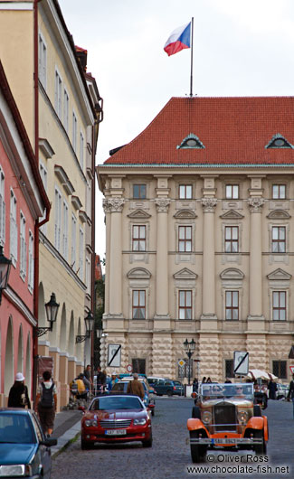 Tourists taking a  tour in a classic vintage car inside Prague Castle