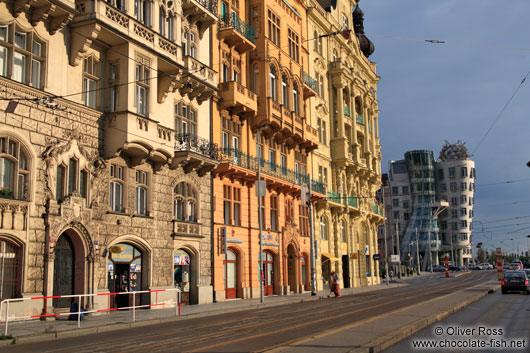 Houses along the Moldau (Vltava) river with the Dancing House in the background