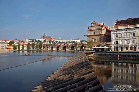 View of Charles Bidge with Moldau (Vltana) river, Smetana museum, and the Prague castle in the background