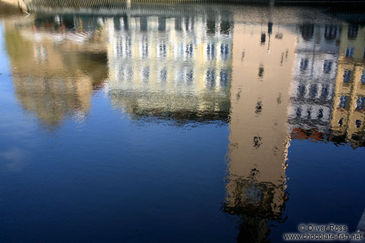 Reflections of houses and the Smetana museum near Charles Bridge