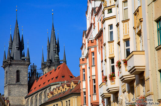Houses in Prague`s Old Town with Tyn church in the background