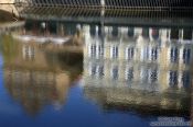 Travel photography:Reflections of houses and the Smetana museum near Charles Bridge, Czech Republic