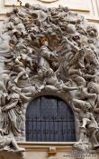 Travel photography:Stucco sculptures above a door of St. James church, Czech Republic