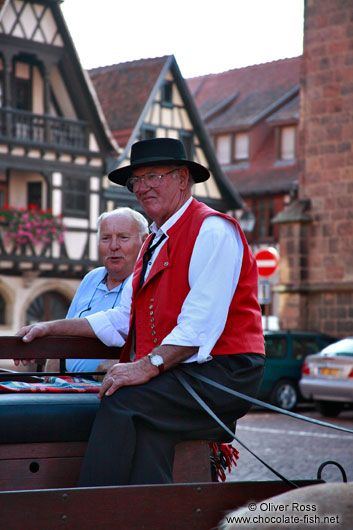 Man in traditional dress on a horse cart in Obernai