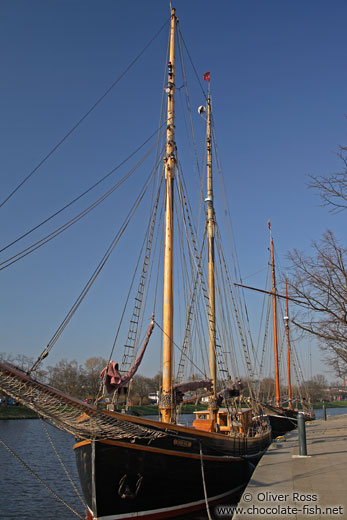 Old sailing boats on the Trave river in Lübeck