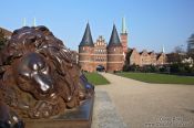 Travel photography:Resting lion outside Lübeck`s Holstentor (city gate), Germany