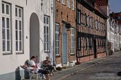 Travel photography:People enjoying the good weather outside their house in Lübeck, Germany