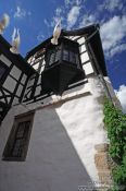 Travel photography:White pigeons taking off from a roof on the Wartburg Castle, Germany