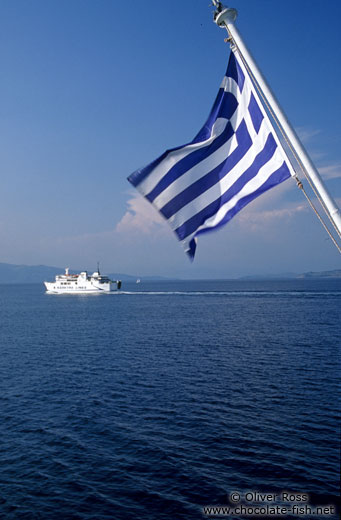 Greek flag with ferry boat