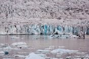 Travel photography:Edge of the Vatnajökull glacier calving into Breiðárlón lake, Iceland