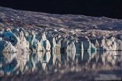 Travel photography:Edge of the Vatnajökull glacier calving into Breiðárlón lake, Iceland