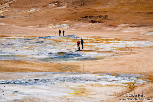 Geothermal field at Hverarönd with fumaroles and mud pools