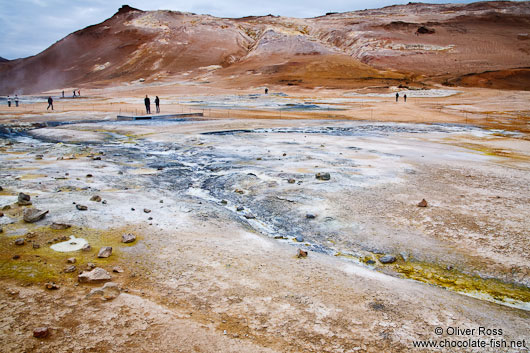 Geothermal field at Hverarönd with fumaroles and mud pools