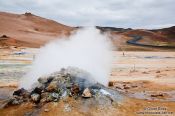 Travel photography:Steam rising from a solfatare at Hverarönd near Mývatn, Iceland