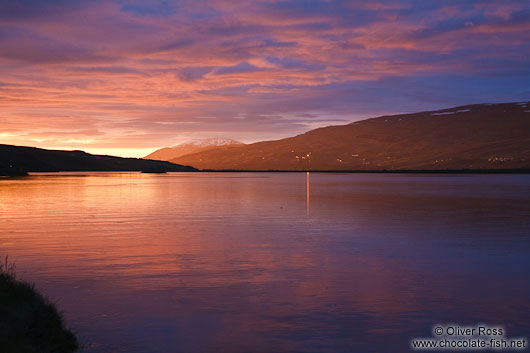 Midnight sun on midsummer night over the Fjord at Akureyri