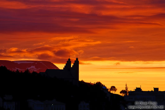 Silhuette of the Akureyri church in the midnight sun on midsummer night