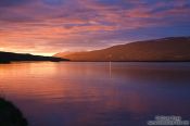 Travel photography:Midnight sun on midsummer night over the Fjord at Akureyri, Iceland