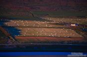 Travel photography:Midnight sun on midsummer night over the banks of the Fjord near Akureyri, Iceland