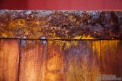 Travel photography:Detail of the rusty rim of a barrel outside the Siglufjörður herring museum, Iceland