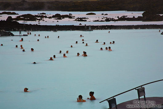 People enjoy the mineral rich waters at the Blue Lagoon (Bláa Lónið)