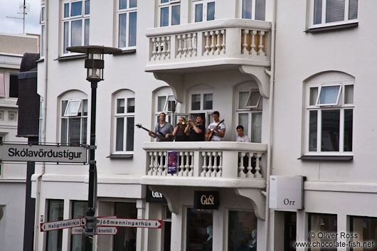 Live music performance in downtown Reykjavik performed on a balcony